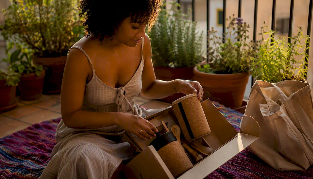 Person unboxing sustainable gift set at home