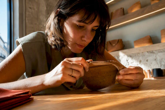 Shopper checking cork stitching in Lisbon