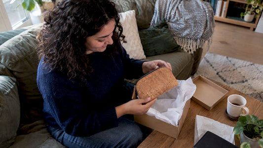 Recipient unwrapping a cork purse gift