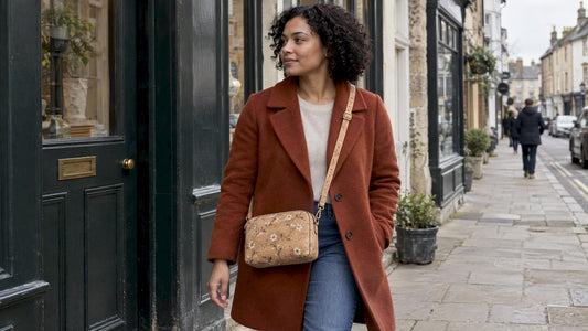 Woman wearing a floral cork crossbody bag